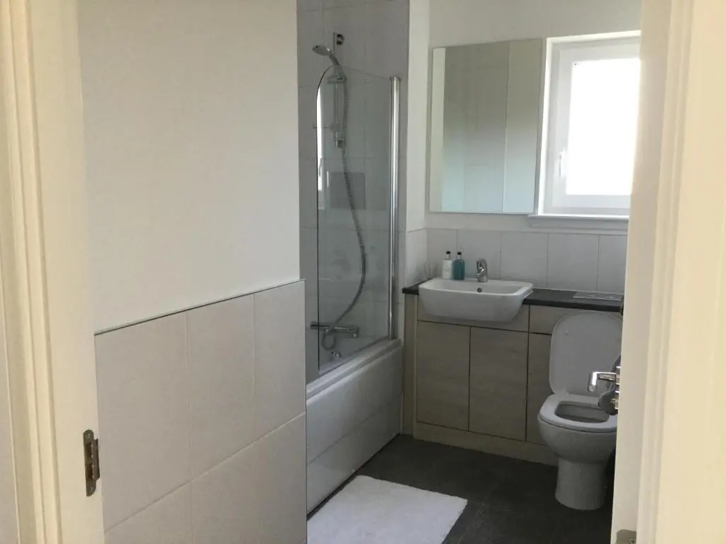 a bathroom with a shower and a toilet and a sink at Amazing views of Inverness in Inverness