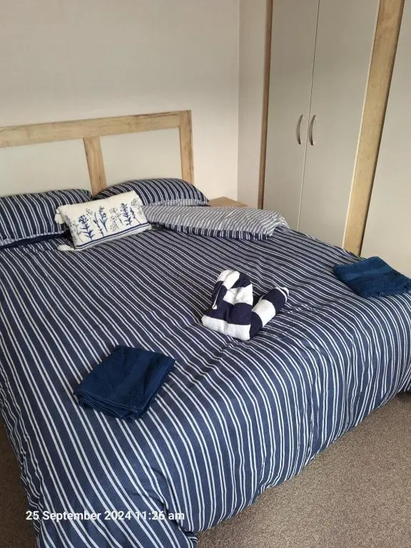 a bed with a stuffed animal sitting on top of it at Lewis Sands PC114 in Lossiemouth