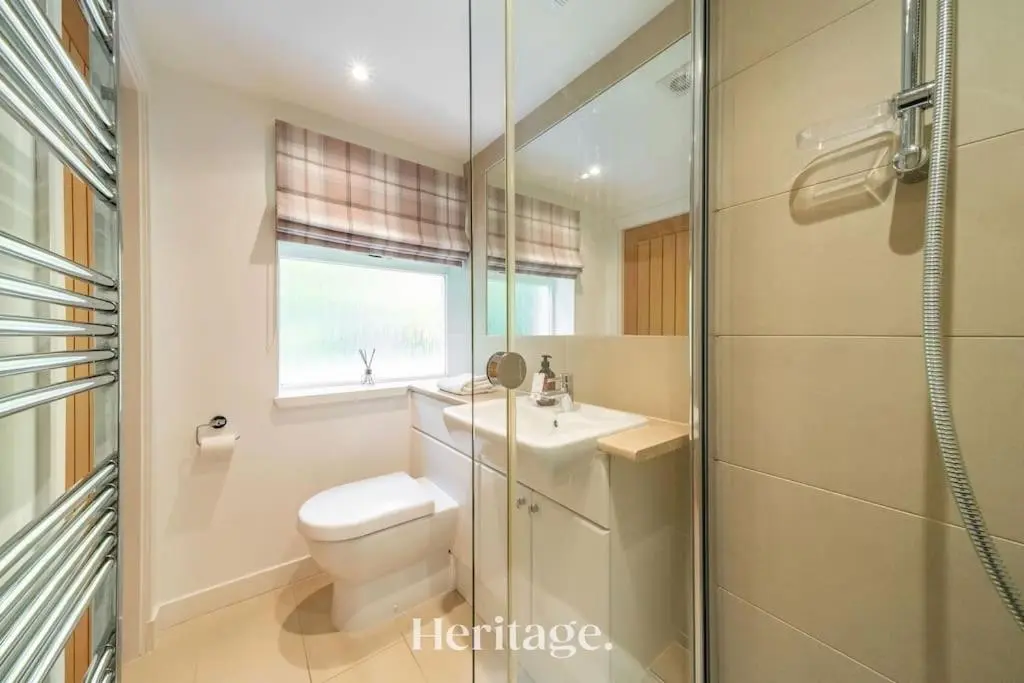 a bathroom with a toilet and a sink and a shower at The Stables Cottage, Aboyne, Peaceful Stay in Royal Deeside in Aboyne