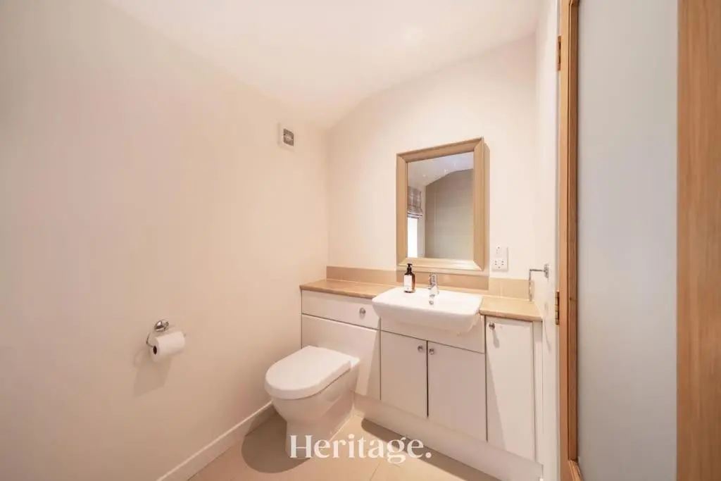 a bathroom with a toilet and a sink and a mirror at The Stables Cottage, Aboyne, Peaceful Stay in Royal Deeside in Aboyne