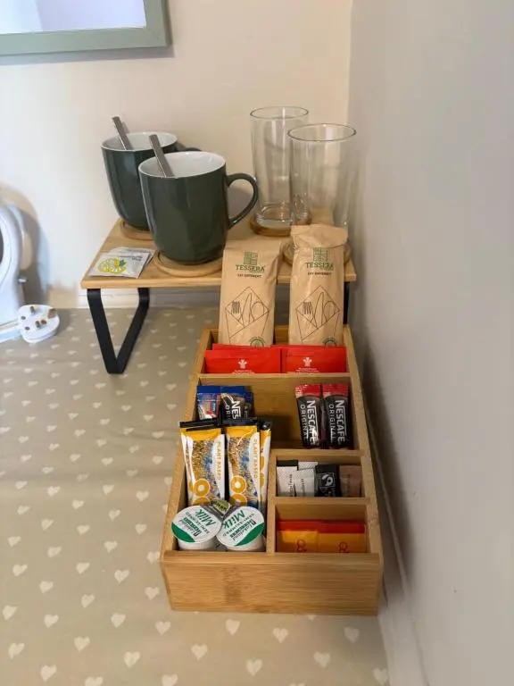 a wooden crate with food items on a table at Carnegie Lodgings, Tain in Tain