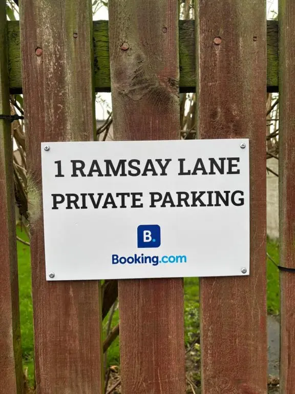 a sign on a fence that says i runaway lane private parking at Ramsay Lane in Lossiemouth