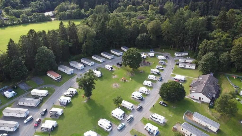an aerial view of a parking lot with parked vehicles at Faskally Woods Holiday Park in Pitlochry