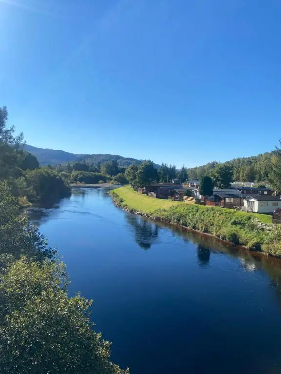 a view of a river from a bridge at The mountain retreat in Aviemore
