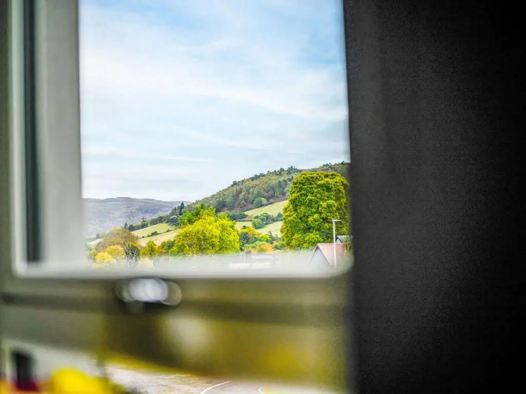 a window with a view of a mountain view at Apartment Craigmonie Apartment by Interhome in Drumnadrochit