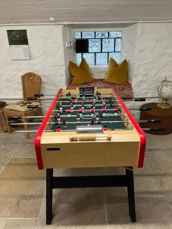 a large pool table in a living room at The Urquhart in Oldmeldrum
