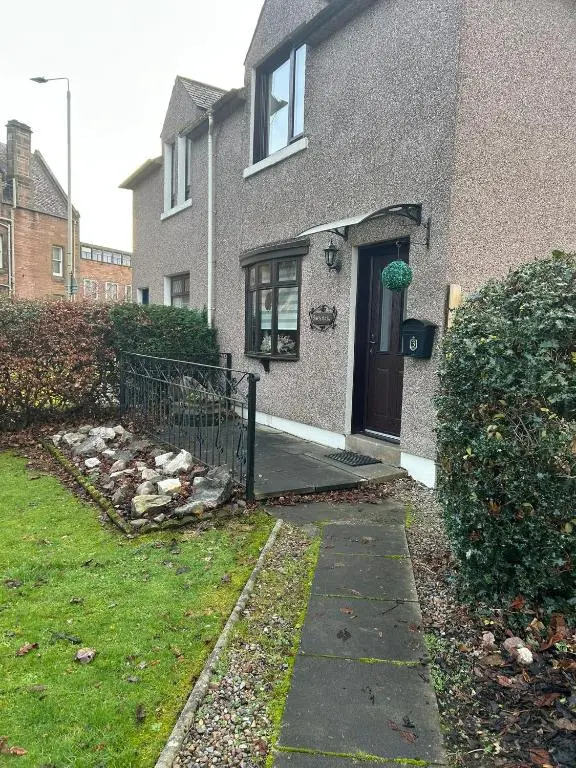 a house with a driveway leading to a door at 2 Bedroom Sheneval House Free Parking in Inverness
