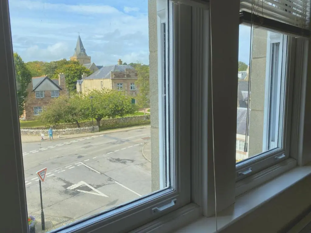 an open window with a view of a street at 1 Argyle Place, Dornoch in Dornoch