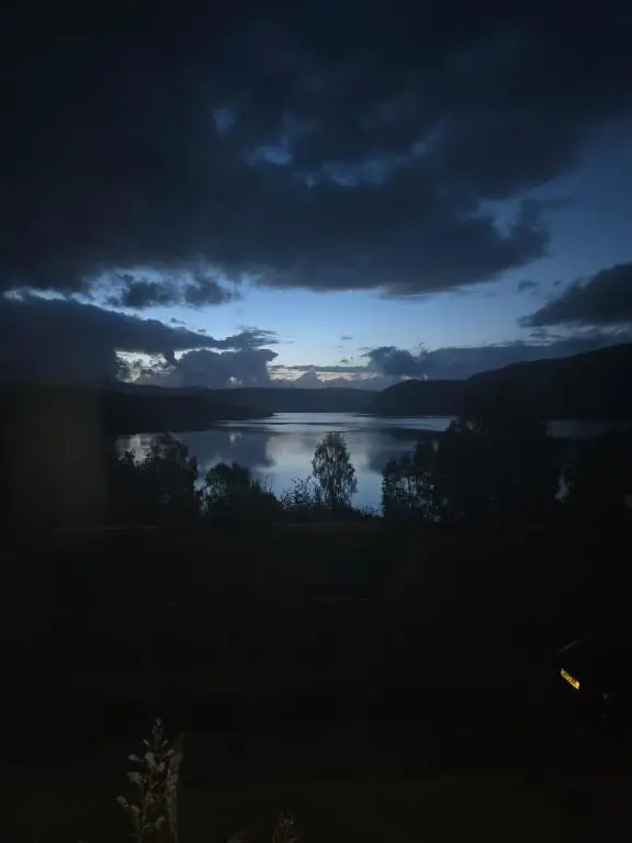 a view of a lake at night at Luichart Lodge in Lochluichart Station