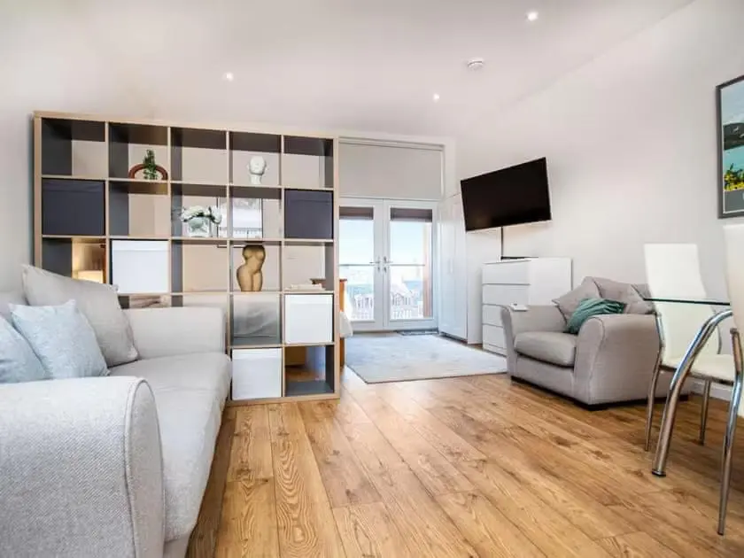 a living room with a couch and a tv at View Apartment in Inverness
