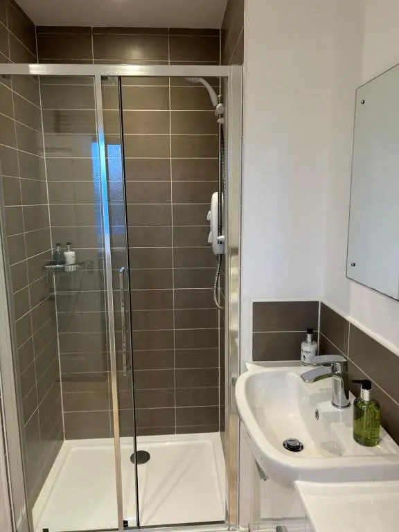 a bathroom with a shower and a sink at Inverness Retreat in Inverness