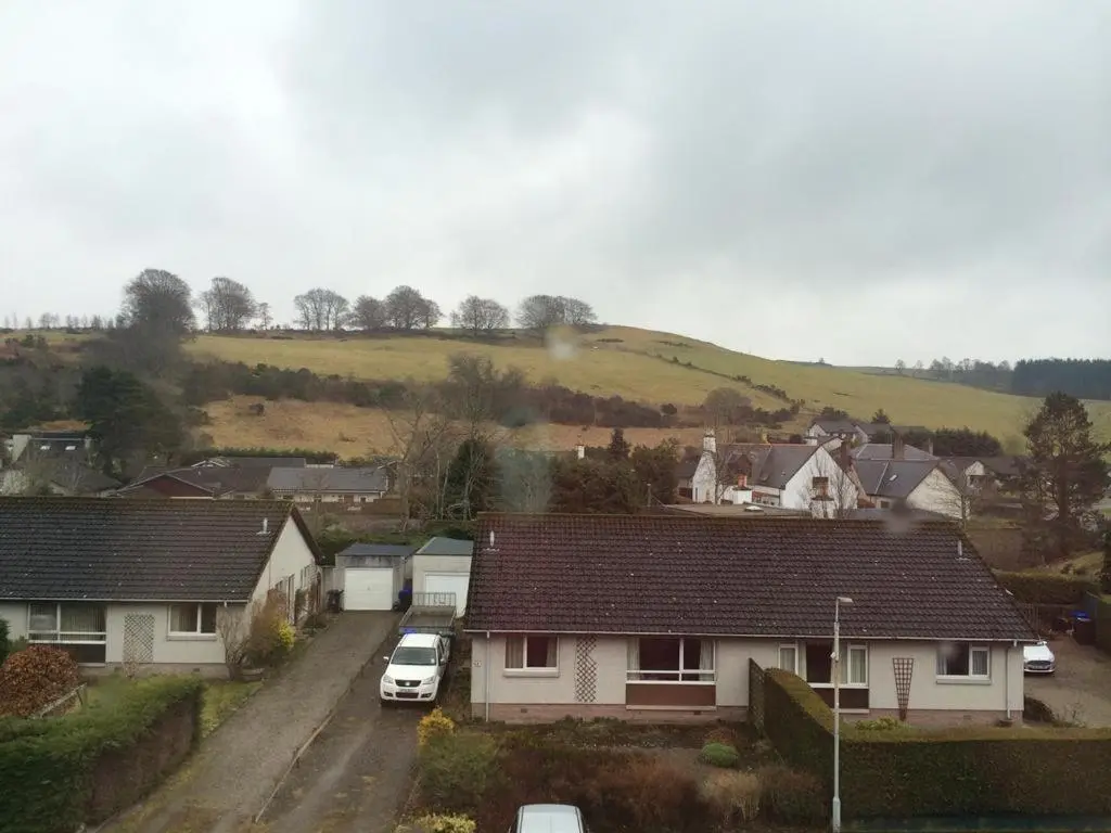 an aerial view of a residential neighborhood with houses at Macbeth Arms in Lumphanan