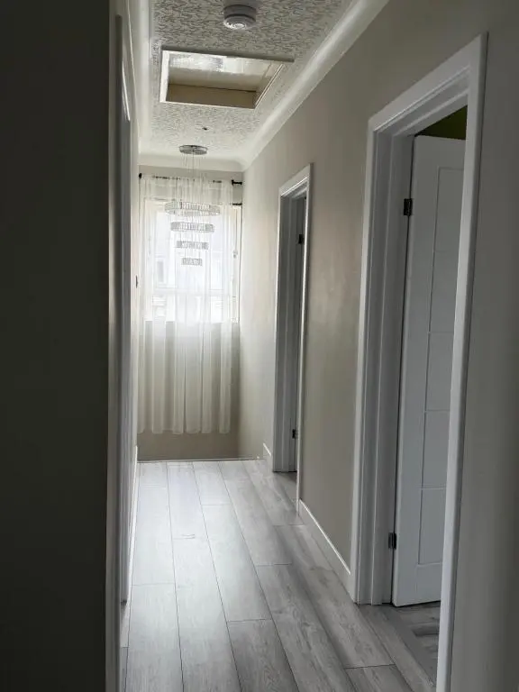 an empty room with a hallway with a window at Cosy Laurel Nest Near Loch Ness in Inverness