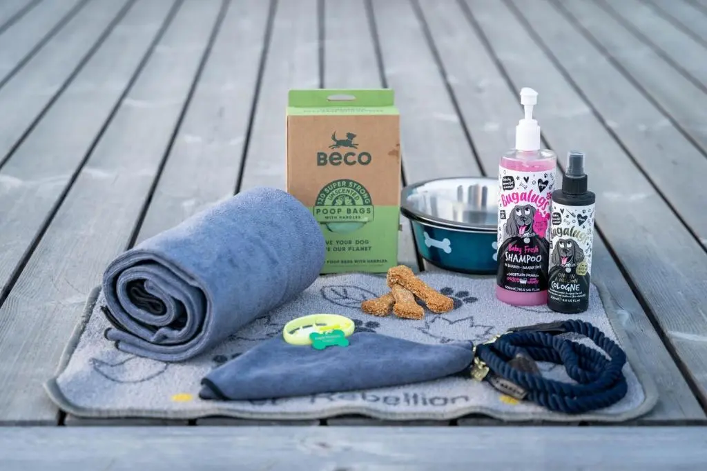 a towel and cleaning products sitting on a table at Woodland Lodge in Huntly