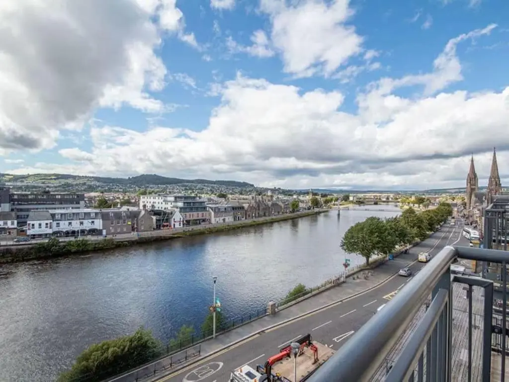 a view of a river from a bridge at 2 Bedroom Riverside Apartment 301-Free Parking in Inverness