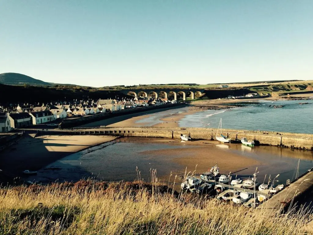 a group of boats in the water on a beach at 244 Seatown Cullen Moray Scotland in Cullen
