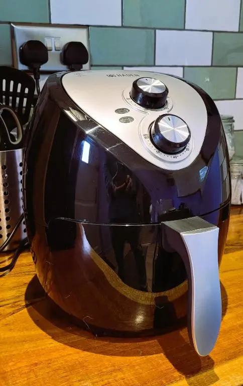 a toaster sitting on top of a wooden table at Bespoke Luxury Self Catering Dog Friendly Accommodation in Archiestown