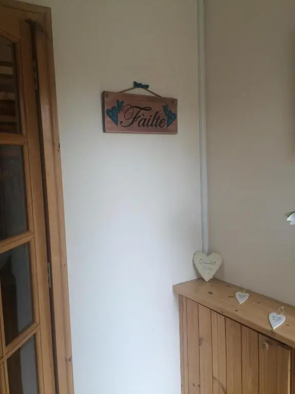a sign that reads faith hanging on a wall at Culliss House B&B in Inverness