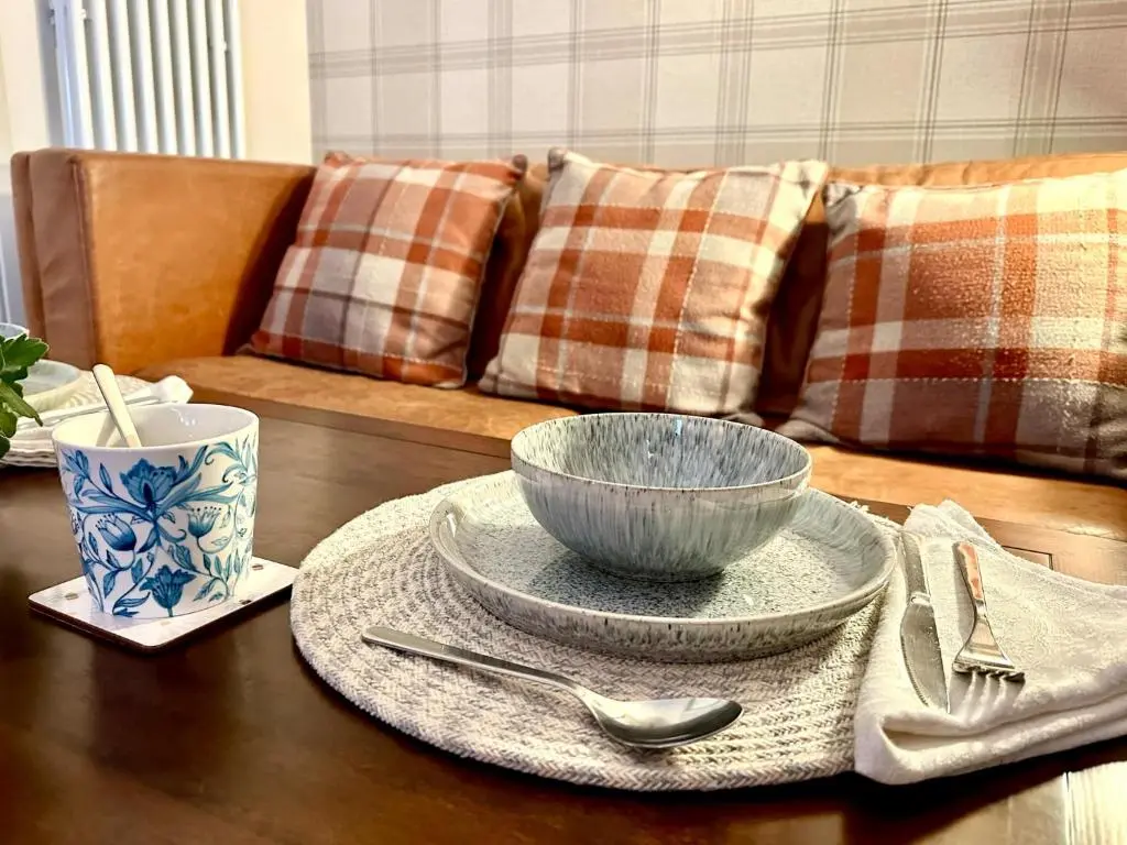 a table with a bowl on top of a table at Beechtree Cottage, Cairngorm Suite, Kirkmichael in Blairgowrie