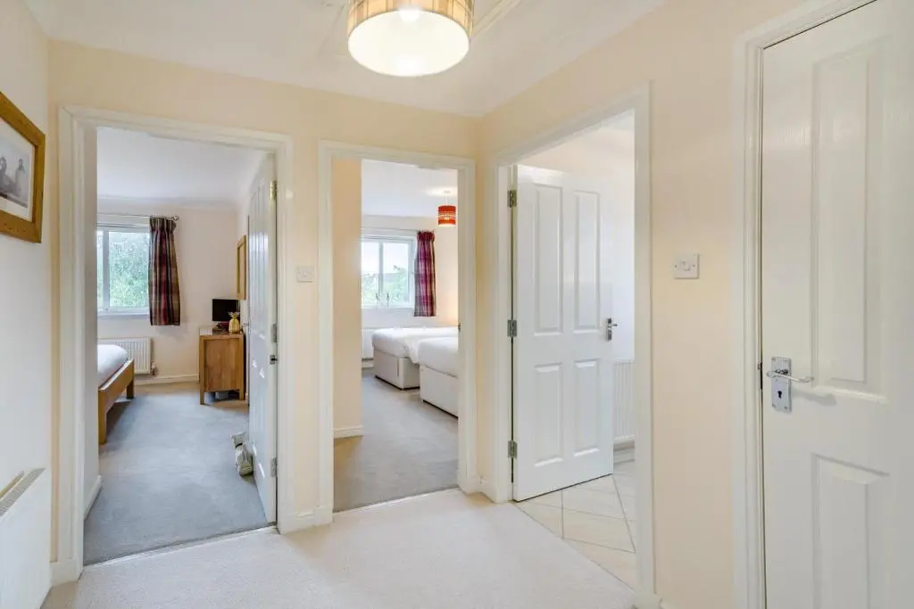 a hallway with a bedroom and a living room at 2 Bed in Aviemore oc-t30584 in Aviemore