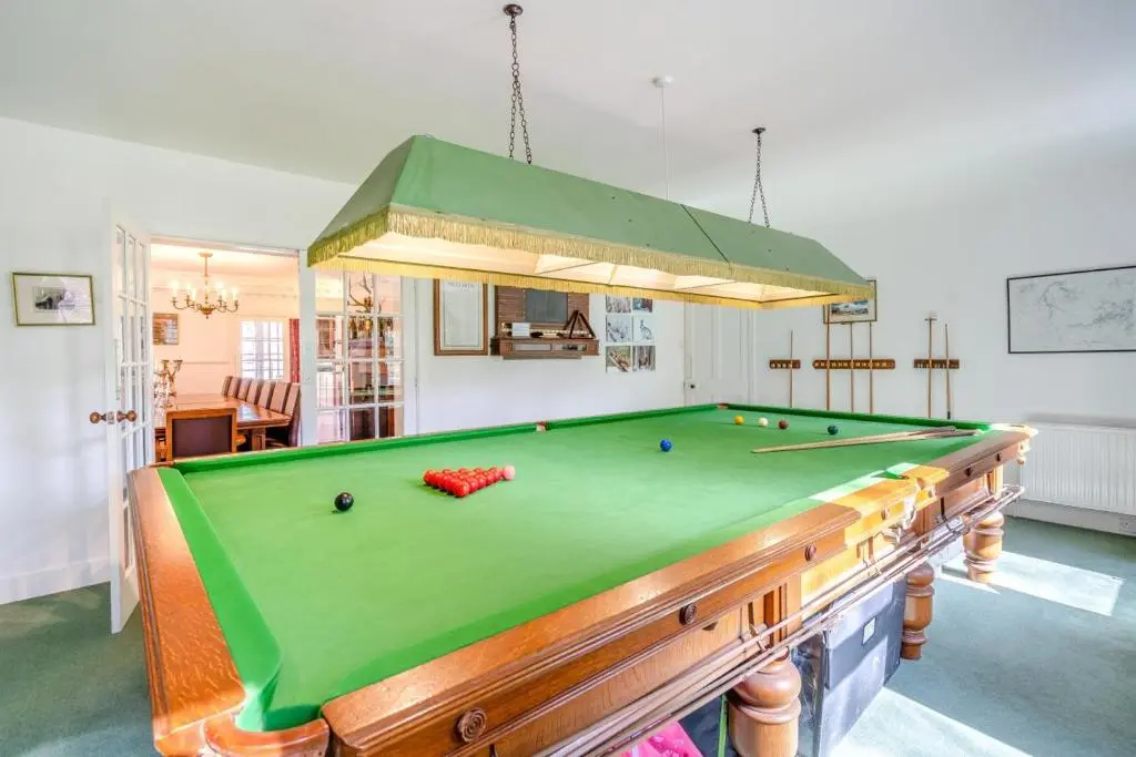 a pool table in a living room with a ceiling at 7 Bed in Strathdon oc-t30594 in Strathdon
