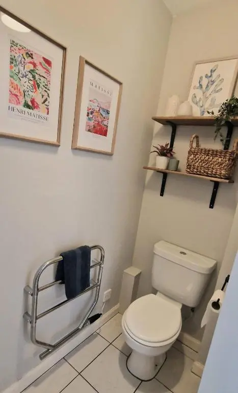 a bathroom with a toilet and a towel rack at North Coast Property - Avoch Beach House - Luxury house with sea views in Avoch