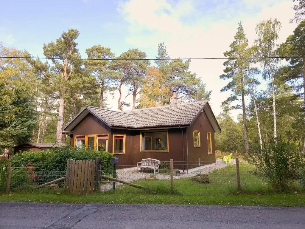 a small house in the middle of a forest at Taigh Mathair Taigh Mathair in Nethy Bridge
