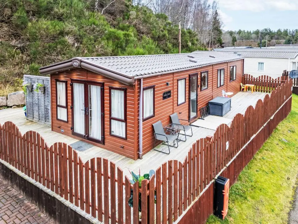 a tiny house on a fence at Chalet Cairn View by Interhome in Aviemore