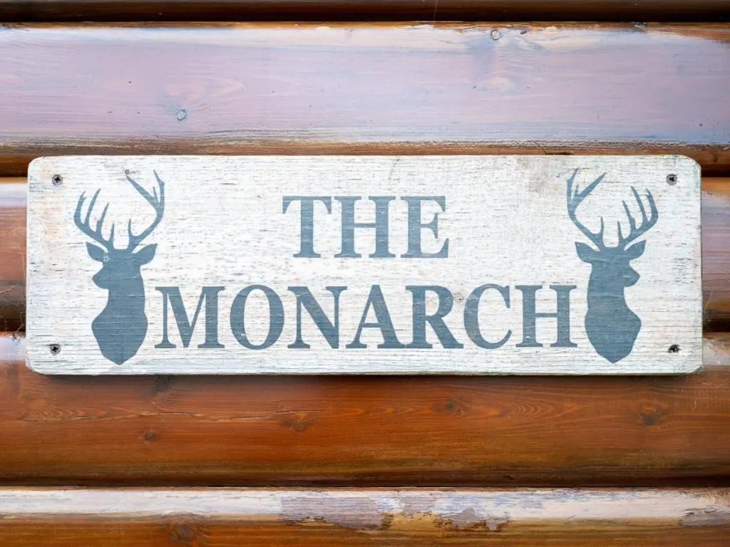 a sign that says the mamchant hanging on a wall at Chalet Monarch by Interhome in Aviemore