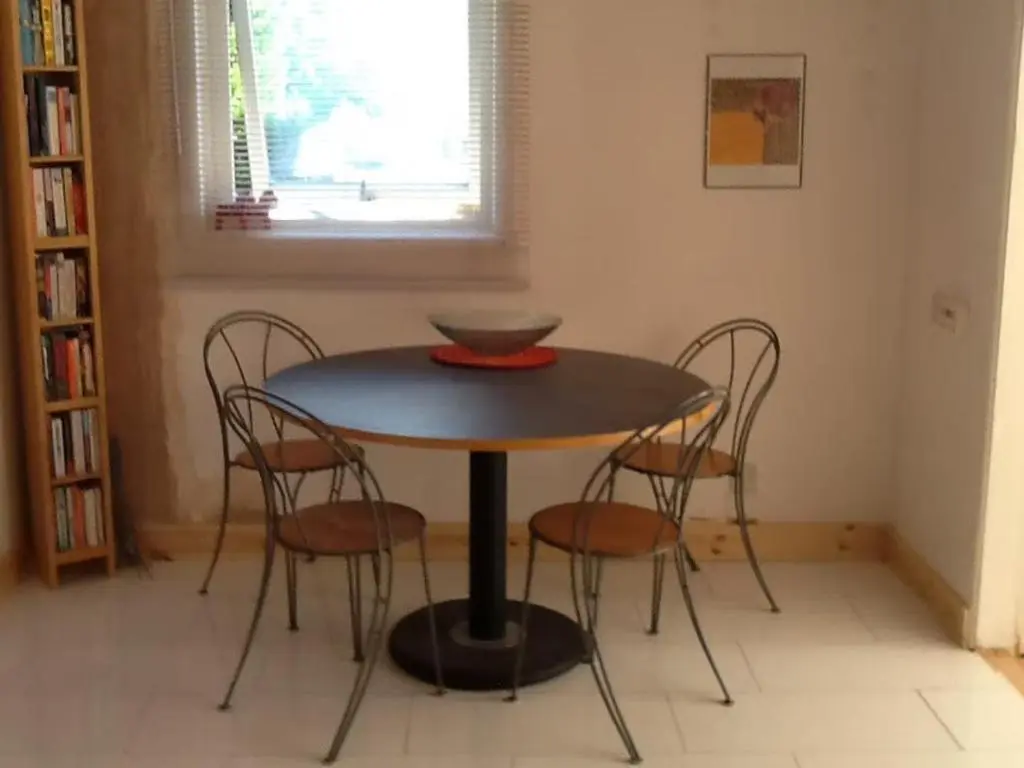 a dining room table with four chairs and a bowl on it at 4guests-2br-privategarden-freeparking in Aviemore