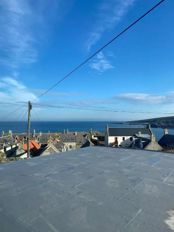 a view of the ocean from the roof of a building at Number Forty Two, Portsoy - A 3 bedroom cottage with sea views in Portsoy