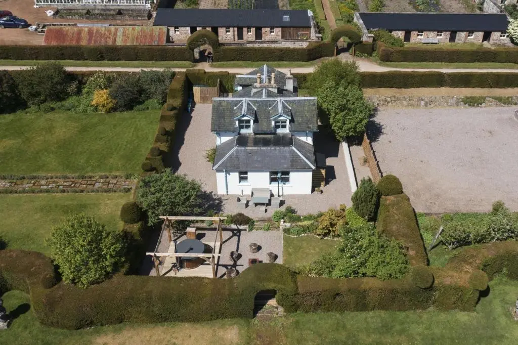 an aerial view of a large white house at Garden Cottage in Inverness