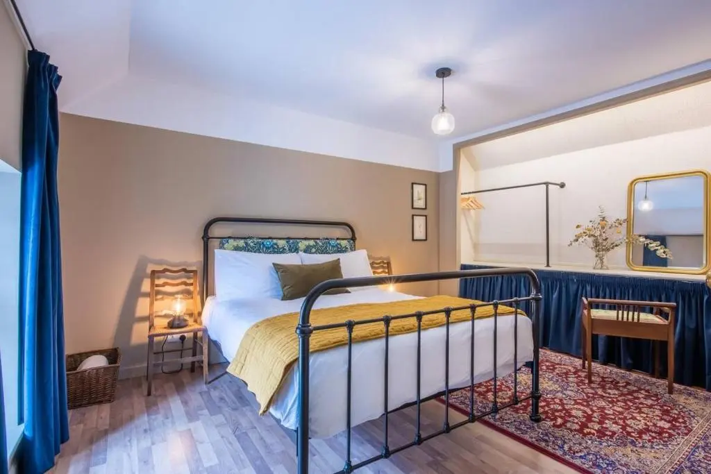 a bedroom with a bed in a room at Weavers Cottage in Inverness