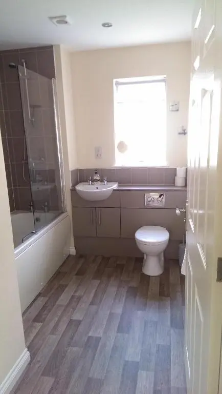 a bathroom with a toilet and a sink and a shower at No1Dornoch in Dornoch