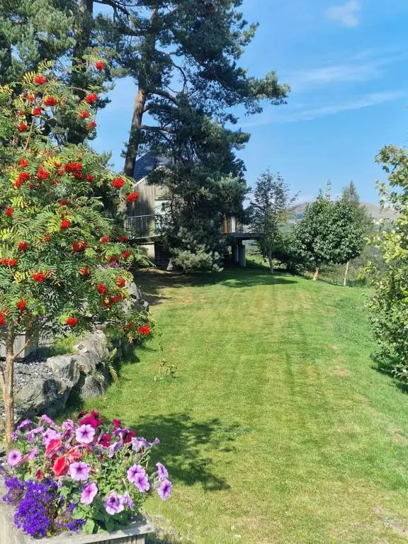a garden with flowers in a yard at Dalnoid Cottages & Treehouses Nr Glenshee in Glenshee