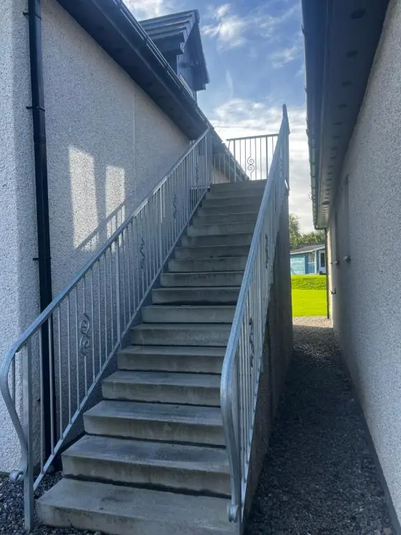 a stairway leading up to a building at Druid Apartment in Inverness