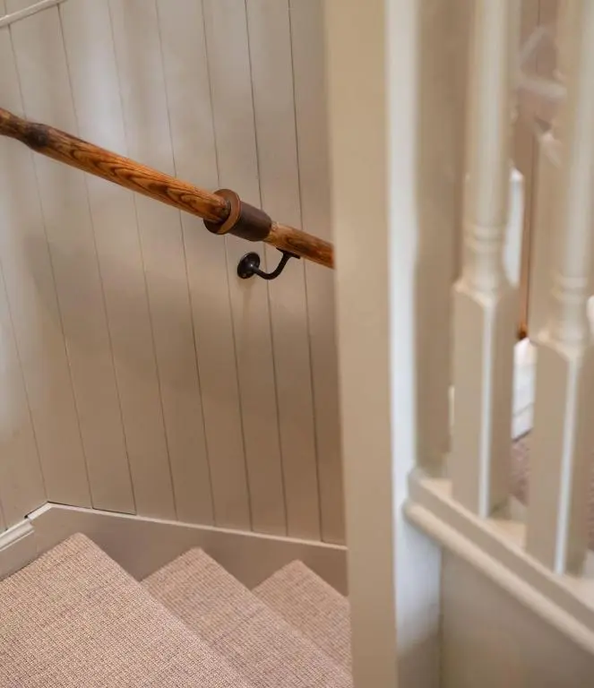 an open door with a wooden handle on stairs at New Brachkashie Cottage in Whitebridge
