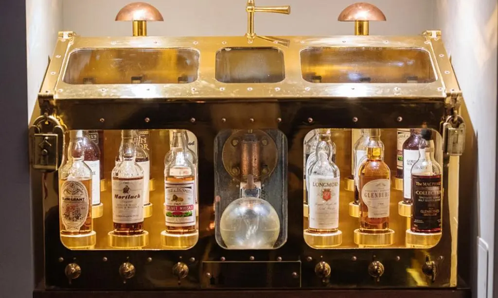 a group of bottles of alcohol on a shelf at The Station Hotel in Rothes