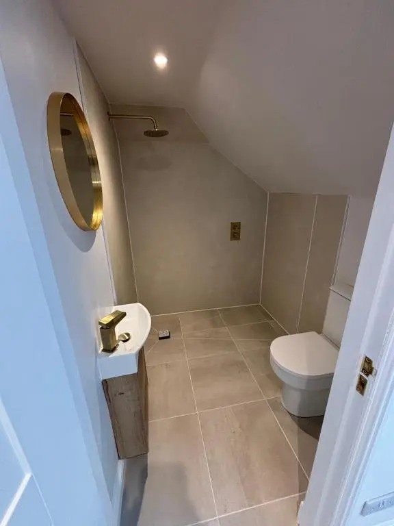 a bathroom with a toilet and a sink at Halfred House in Wick