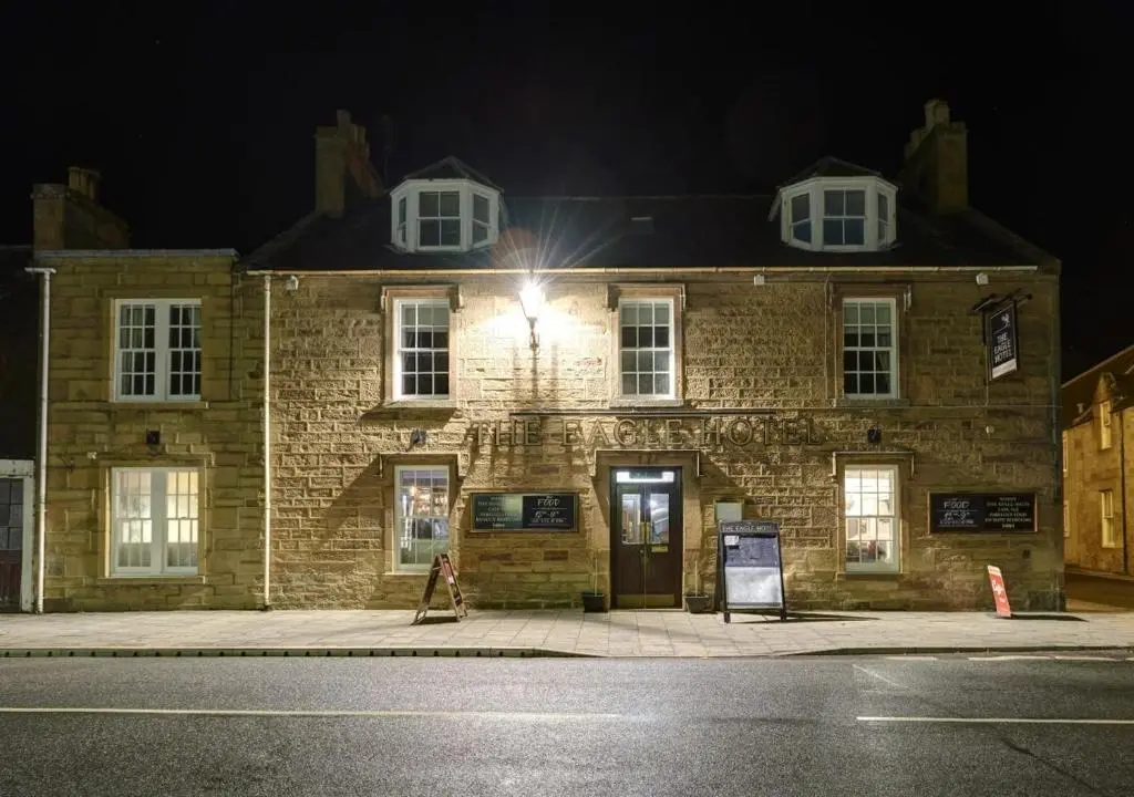 a brick building with a light on top of it at Eagle Hotel in Dornoch