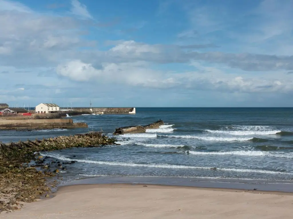 a view of the ocean with waves hitting the beach at Apartment Harbour Nights Deluxe 7E by Interhome in Lossiemouth