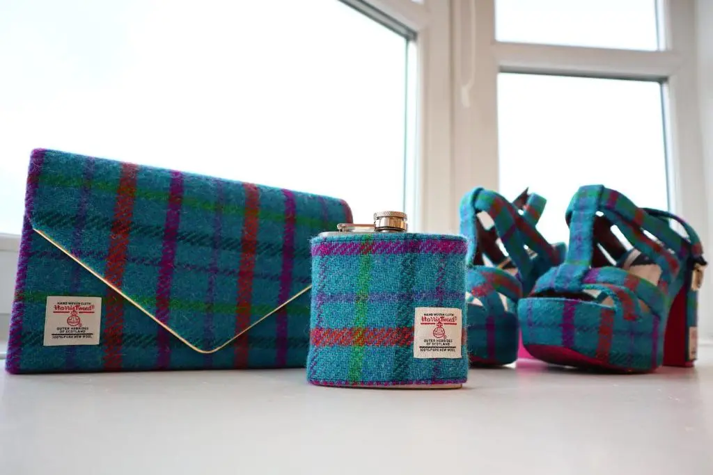 a group of three bags and a bottle on a table at The Wee Heilan' Dram in Keith