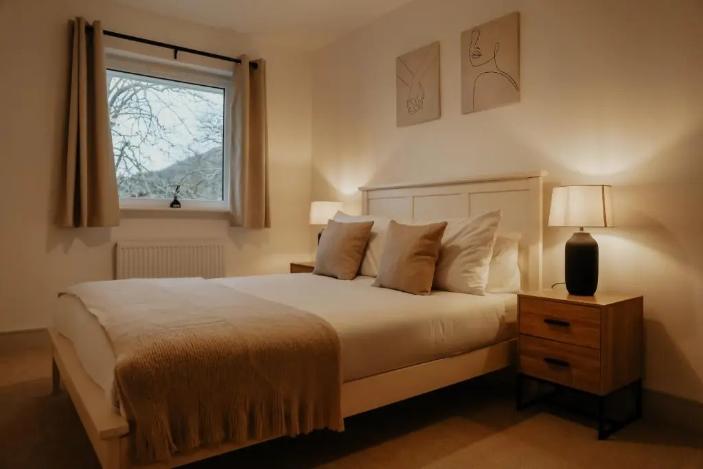 a bedroom with a large bed and a window at Luxurious Apartment in Inverness in Inverness