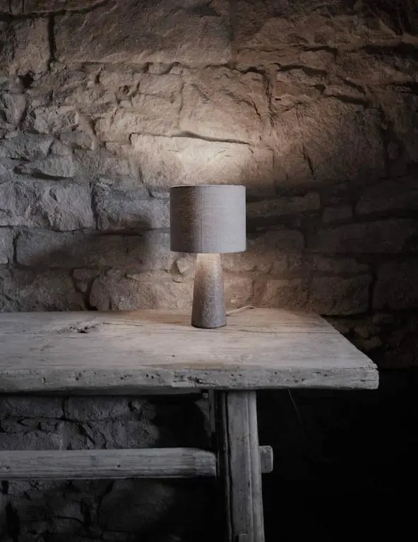 a wooden table with a lamp on top of it at Luxury lodge for 16 in Royal Deeside in Ballater