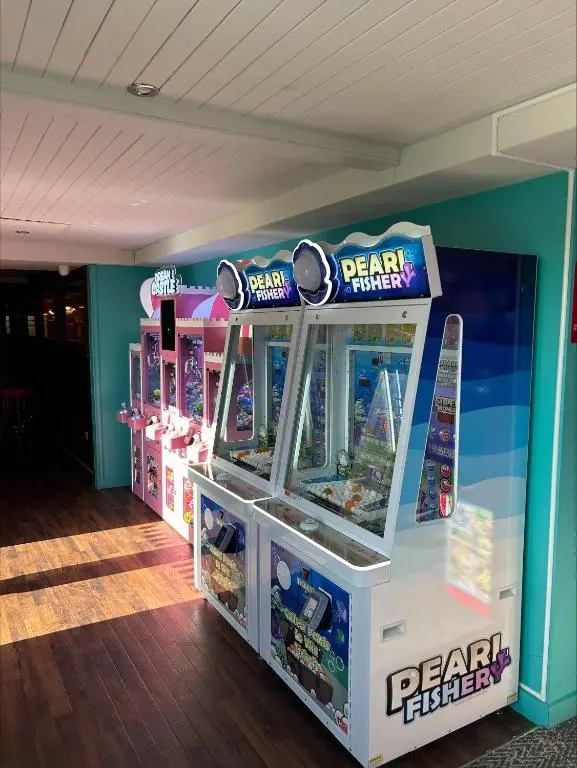 a room with a beach fight fighter arcade game at Silversands holiday park new caravan in Lossiemouth