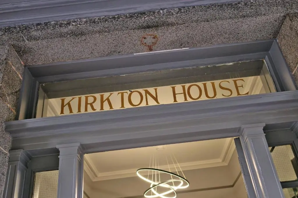 a sign over the door of a kittiton house at Kirkton House in Kirkton of Skene