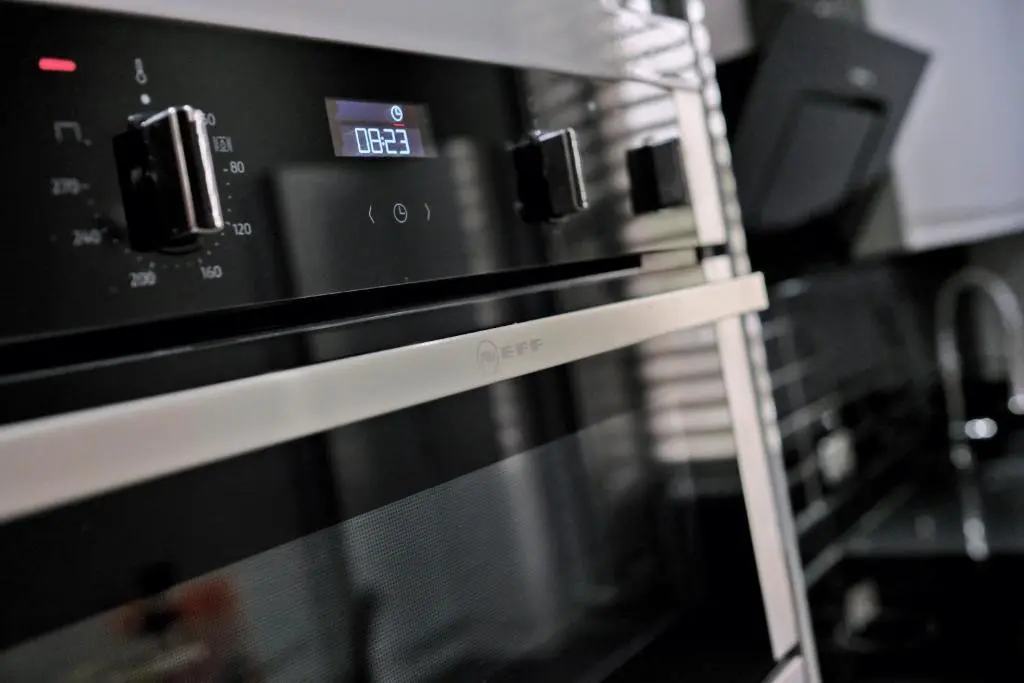 a black microwave oven sitting in a kitchen at Kirkton House in Kirkton of Skene