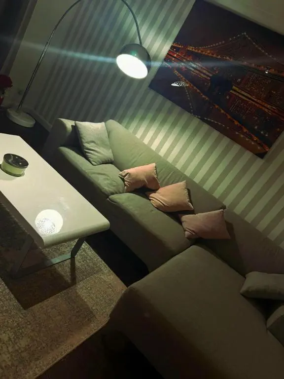 a living room with a couch and a table at Luxury 2 bedroom apartment in Aberdeen in Kirkton of Skene