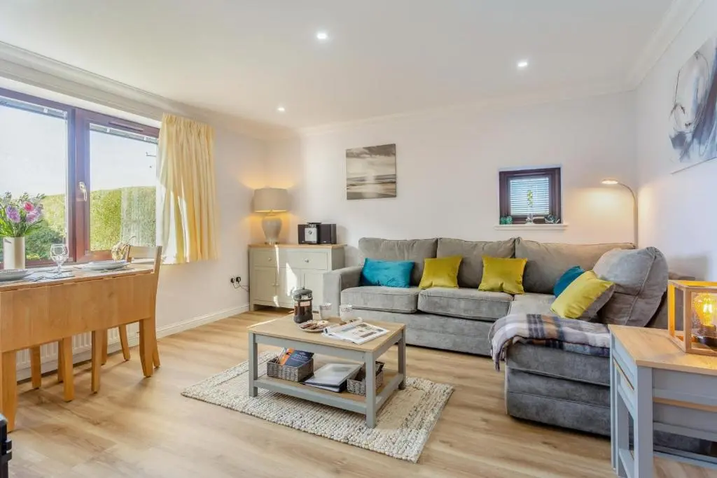 a living room with a couch and a table at 2 Bed in Insch oc-t30986 in Colpy