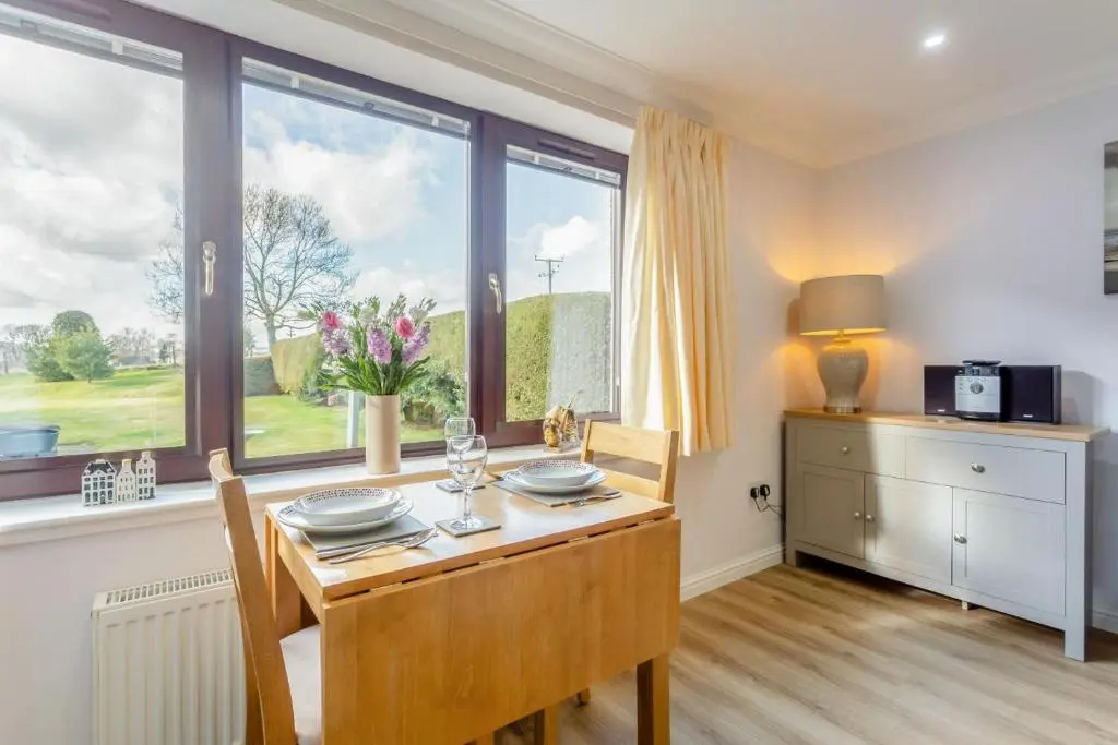 a dining room with a table and a window at 2 Bed in Insch oc-t30986 in Colpy